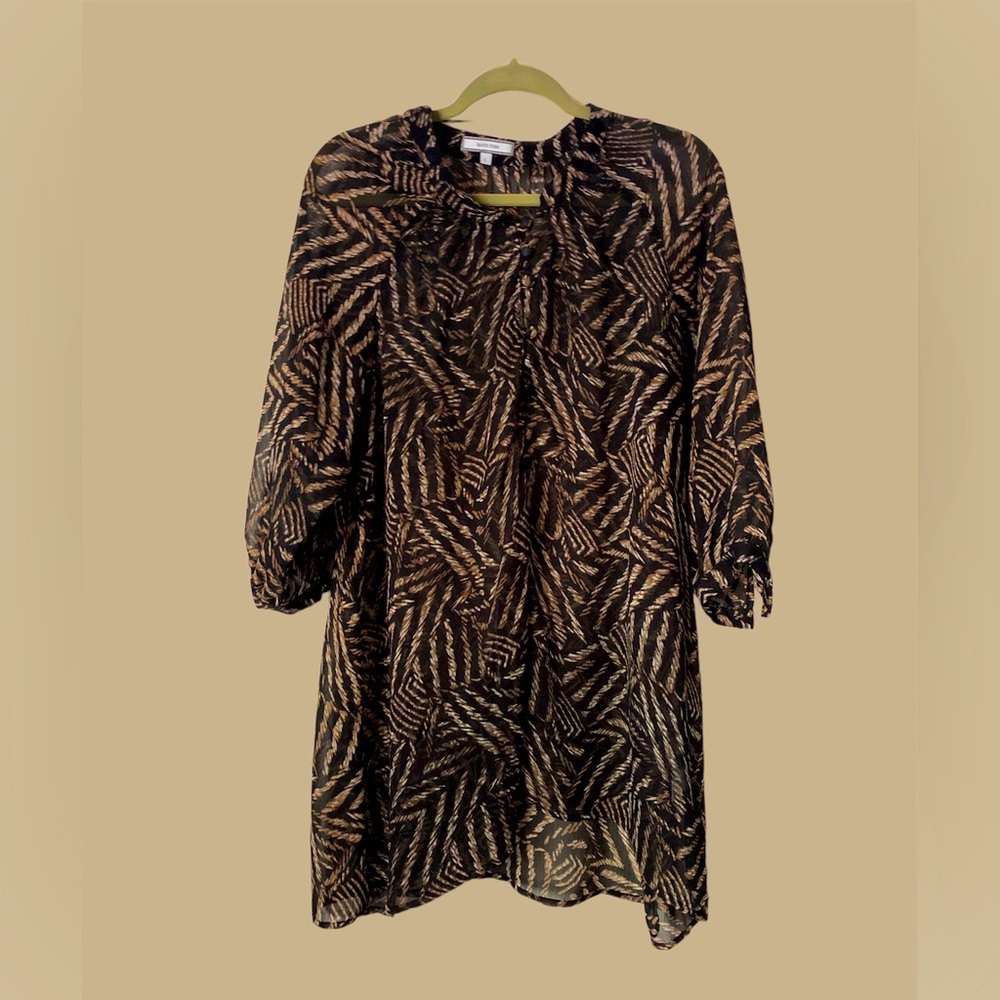 Feather print light weight layering tunic. 9 button front for cami exposure.